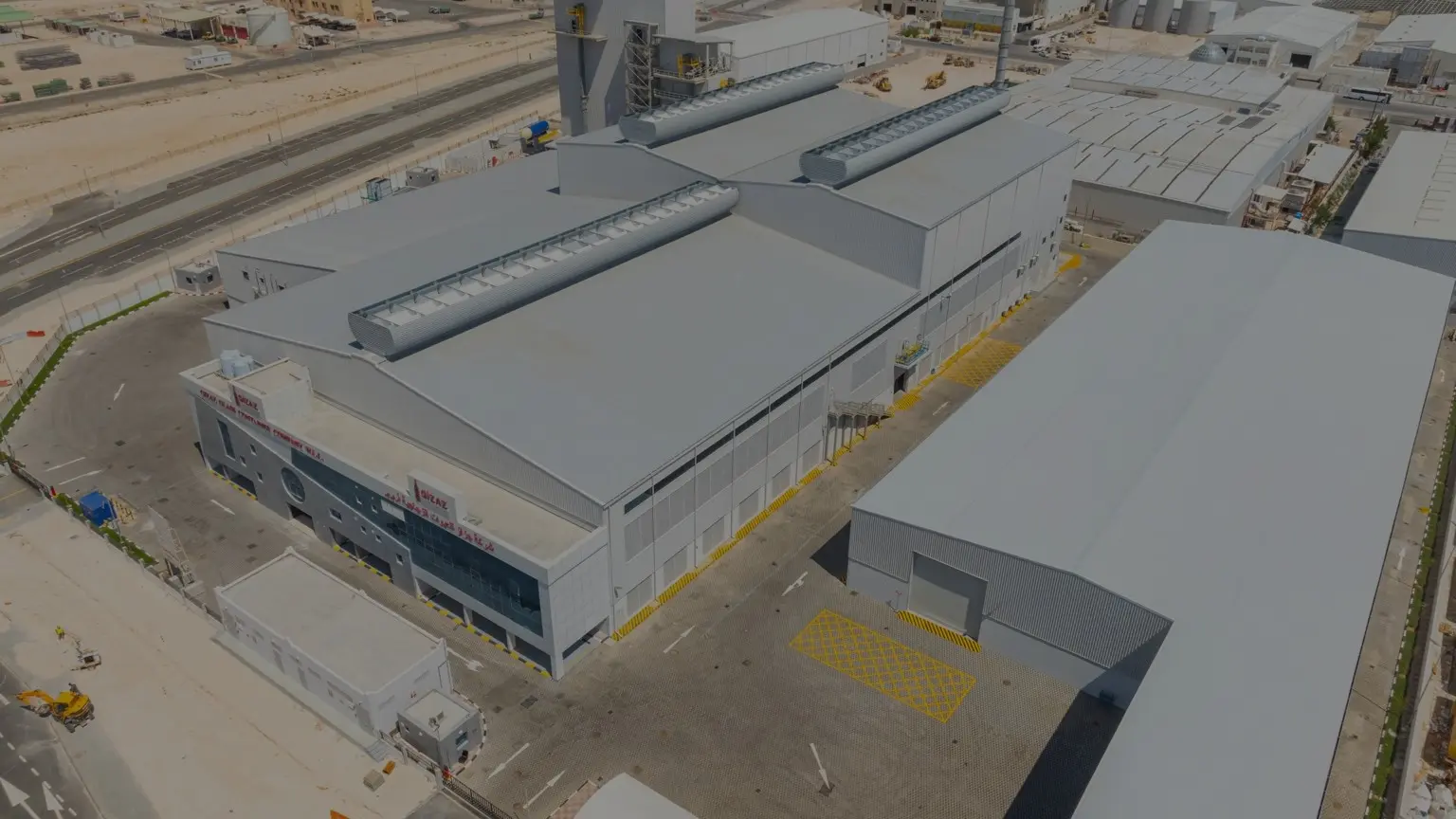 Aerial view of a large glass manufacturing facility