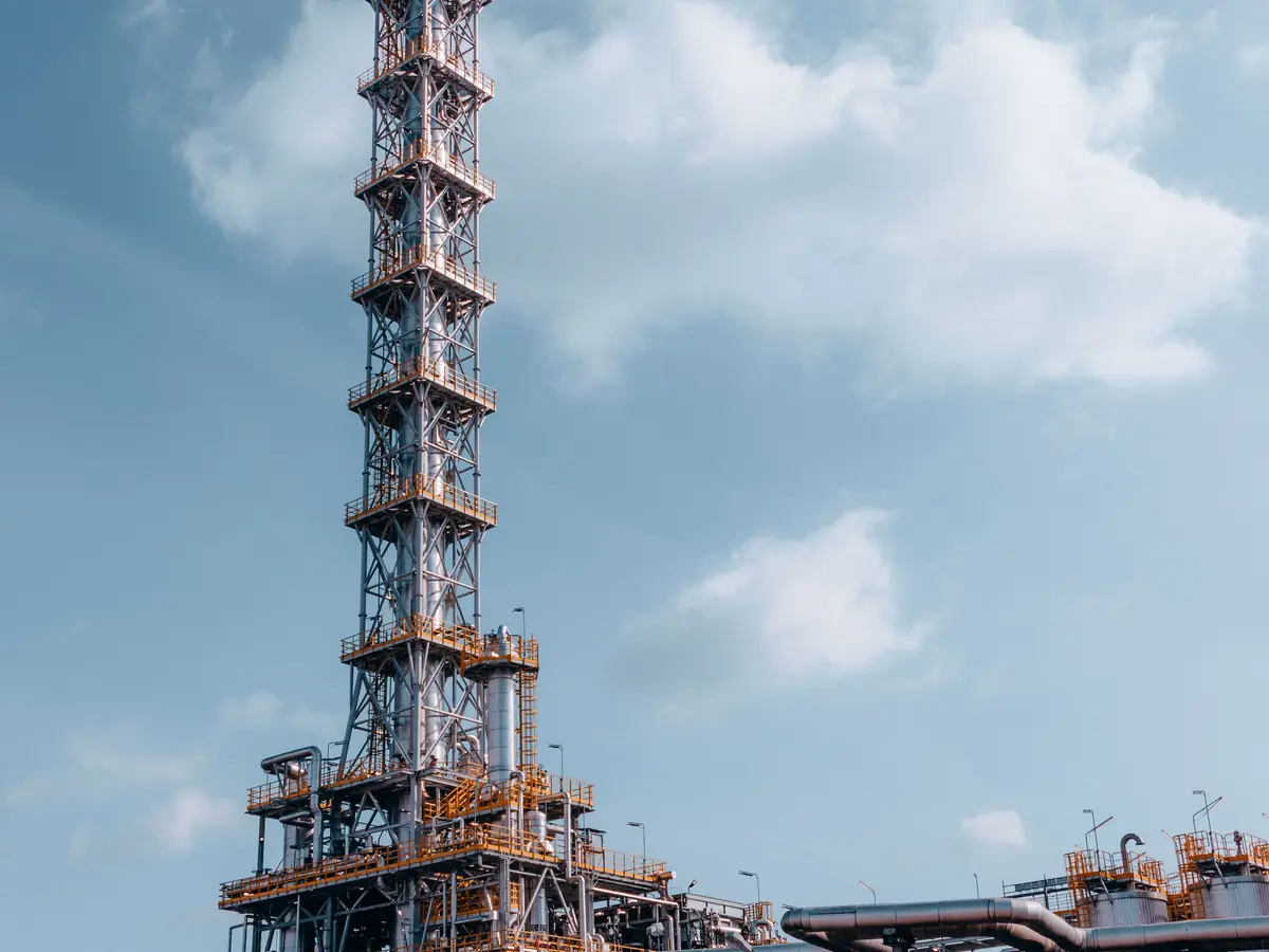 Industrial oil refinery with processing towers and pipework