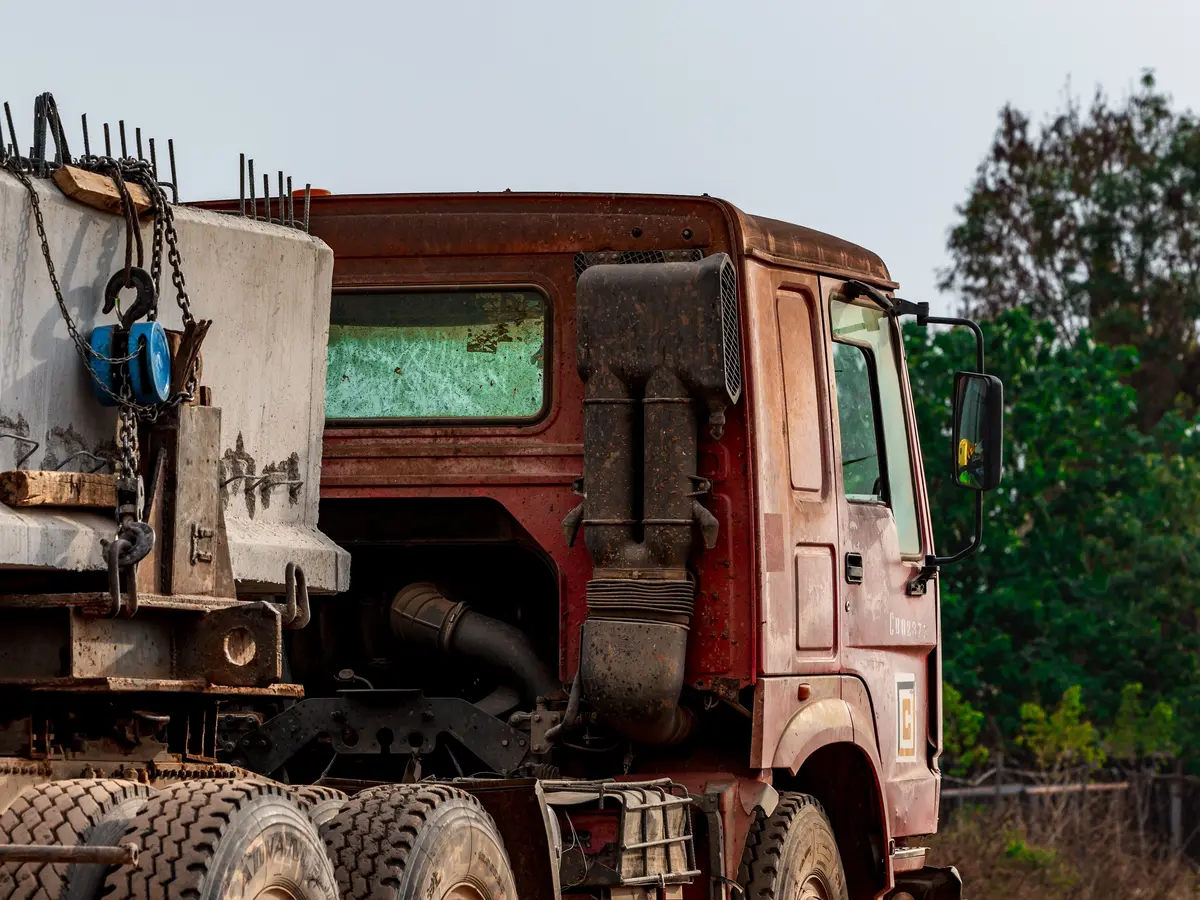 Heavy construction truck transporting materials at a worksite